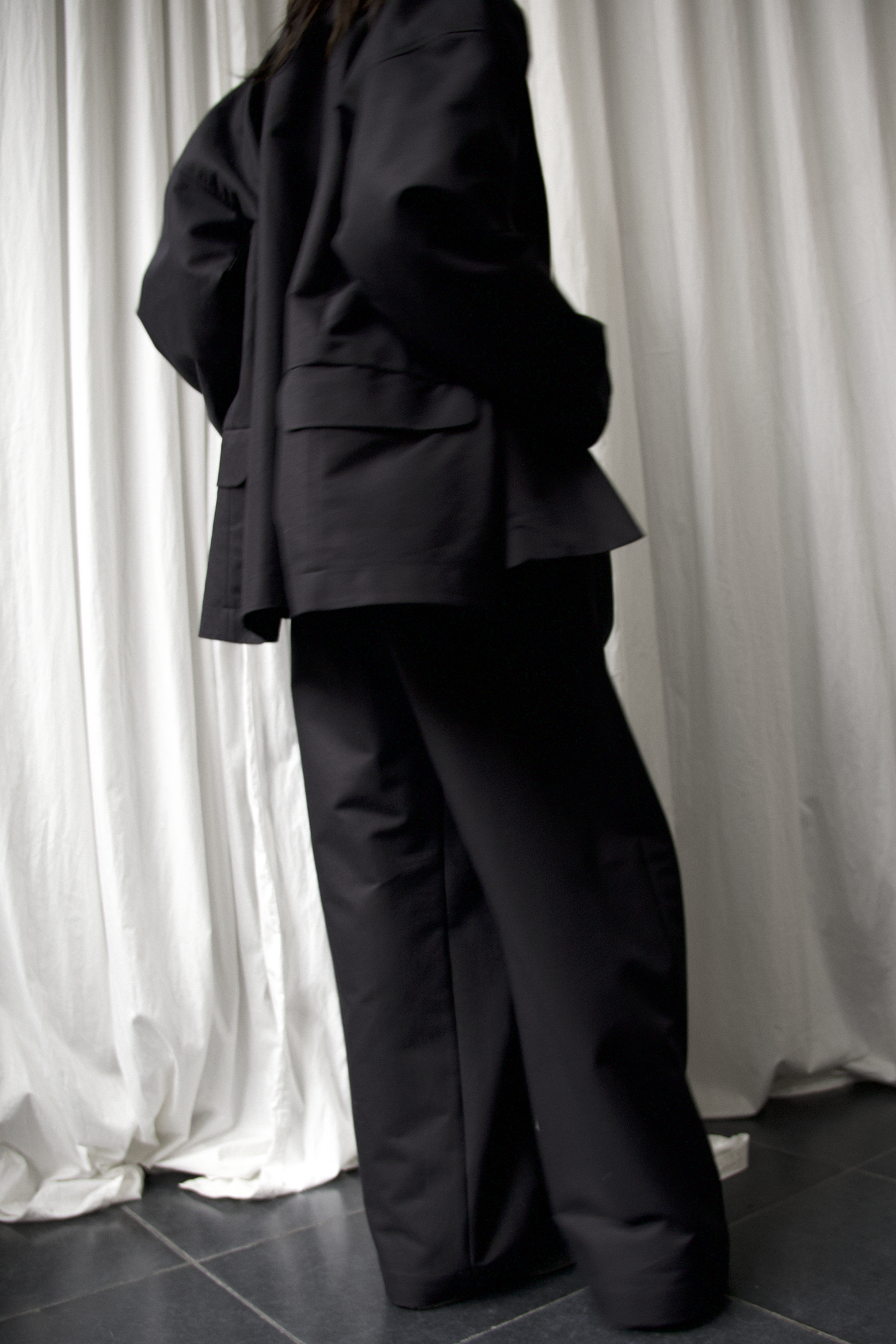 ARCHETYPE Billowing trousers in black heavy twill