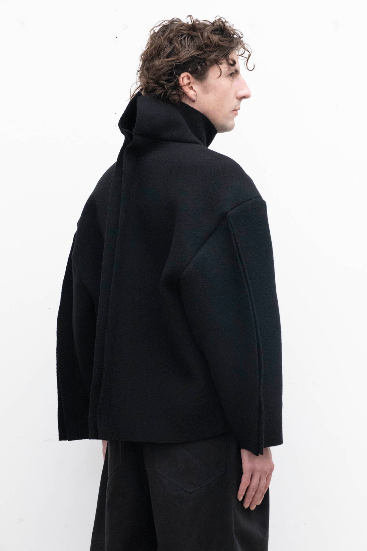 SUI GENERIS Sweater with Riveted Dorsal Seam in Black Duffle Wool