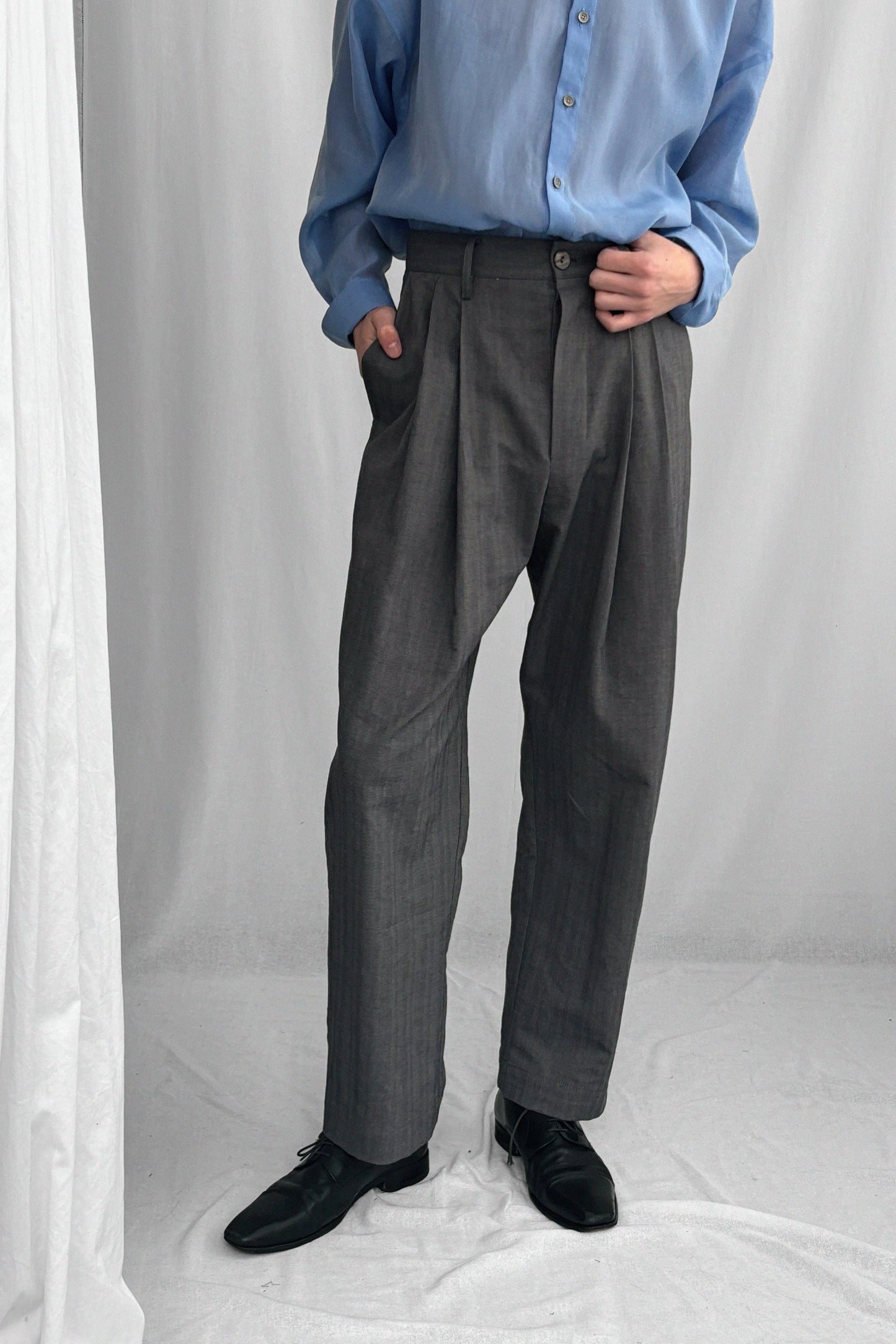 ARCHETYPE NARROW PLEATED COTTON TROUSERS